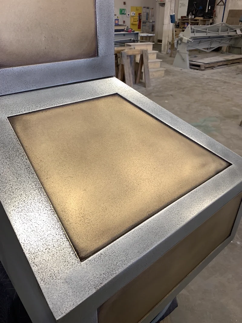 Custom cast pewter and brass range hood by La Bastille